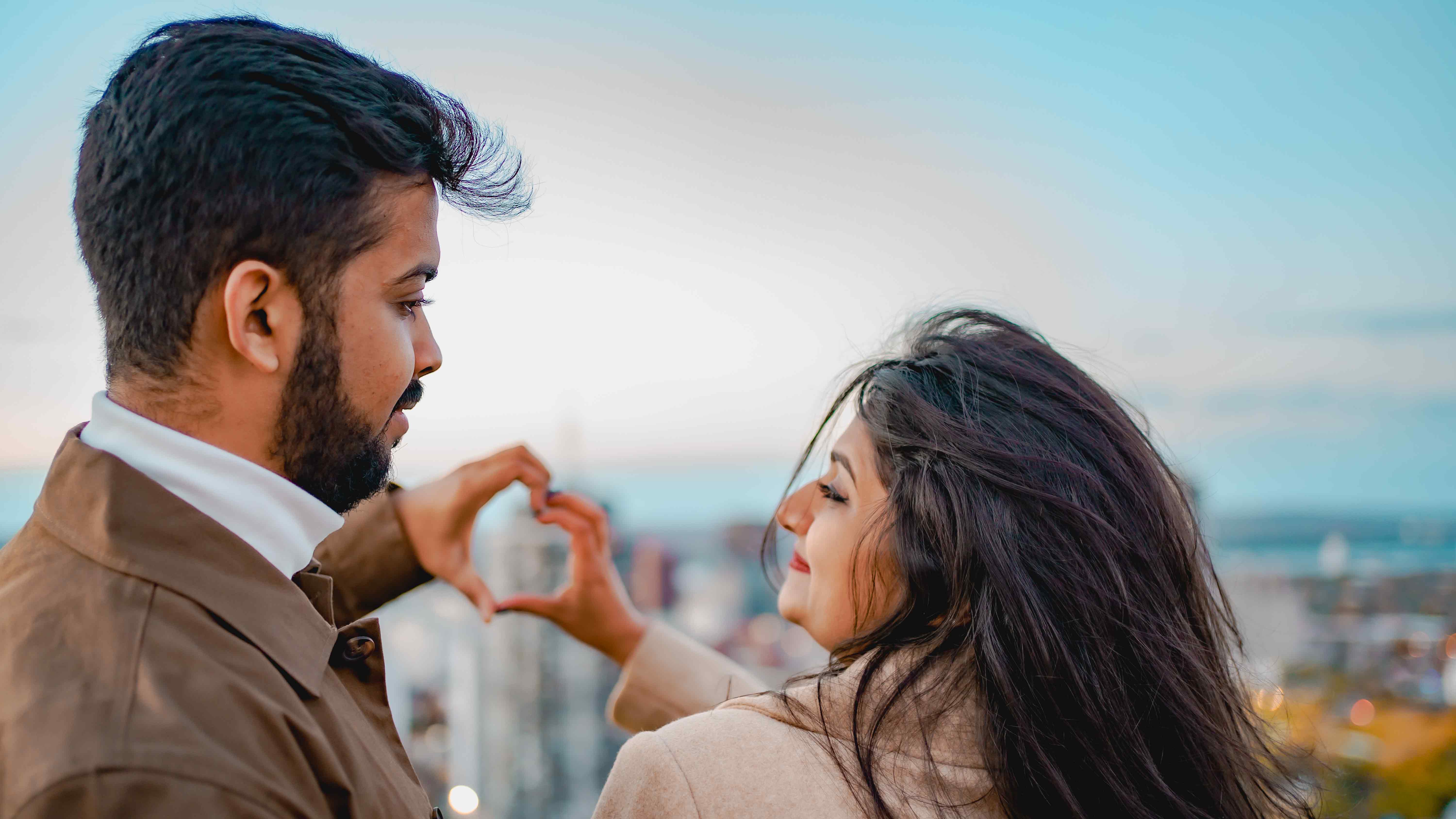 Heart hands with city view
